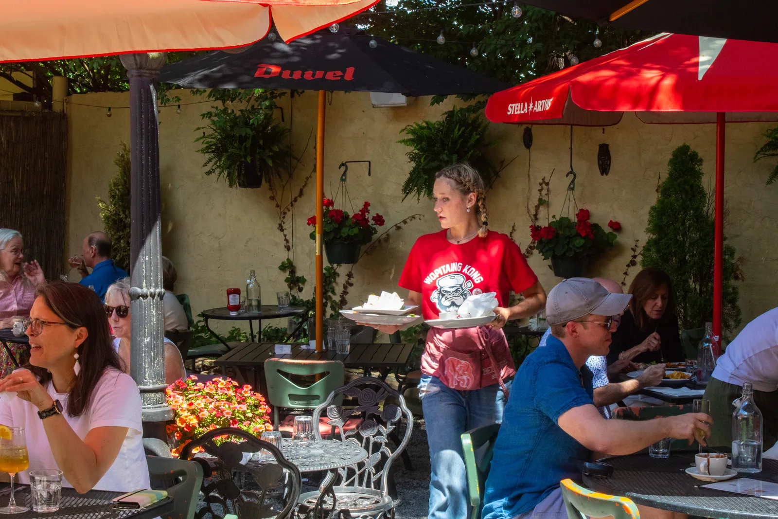 Server on the busy outdoor dining patio at Luca Bistro, Cincinnati