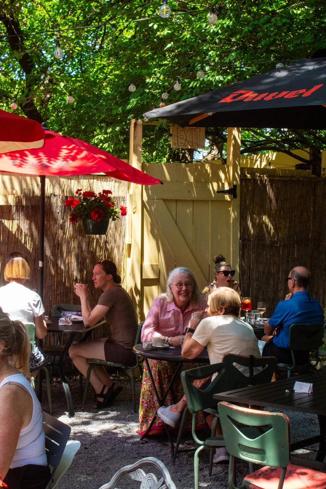 Guests enjoying outdoor dining on the back patio at Luca Bistro in Mt. Adams